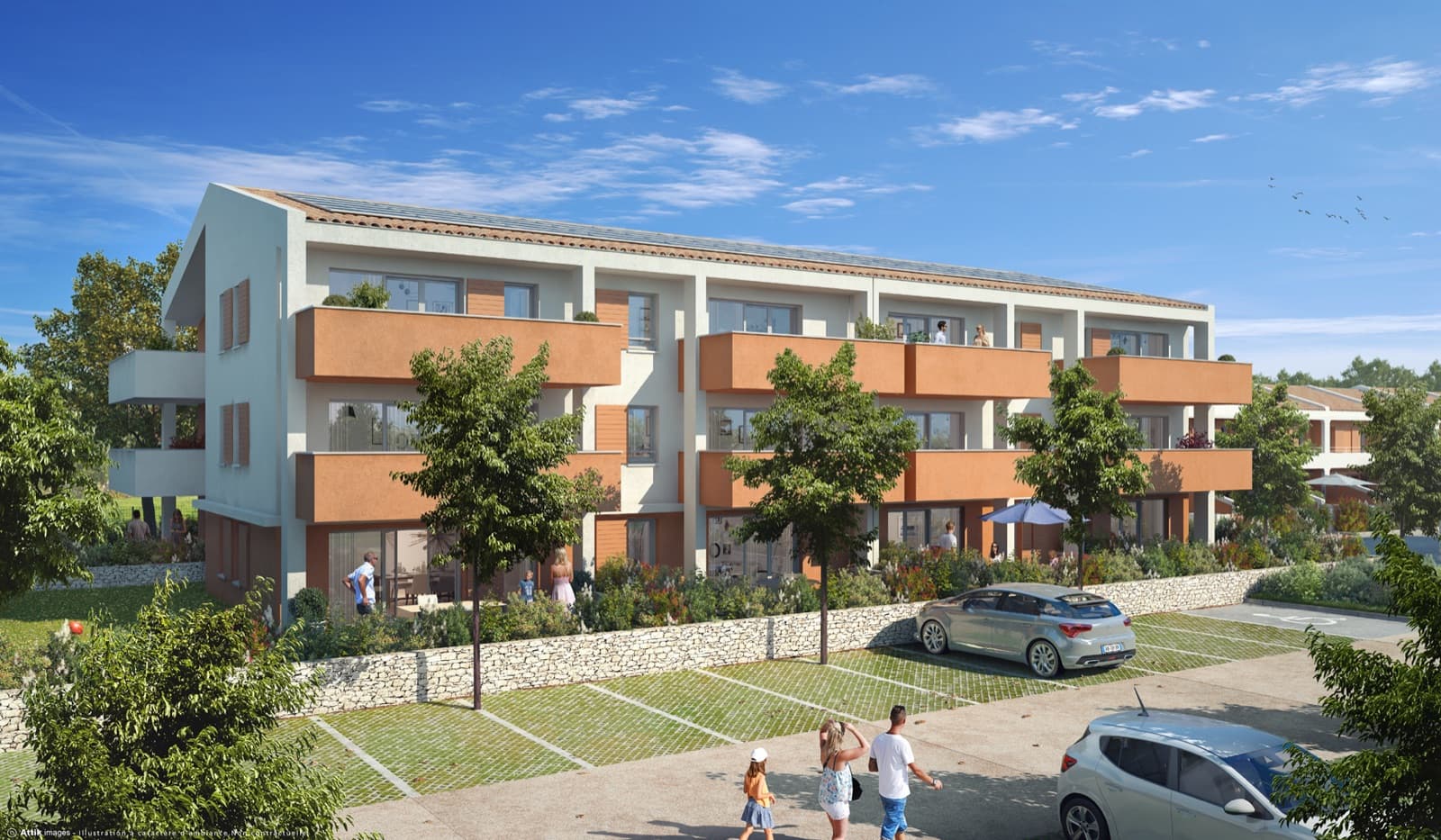 Résidence collective aux balcons ocre à Saint-Rémy-de-Provence, jardins plantés au pied des logements.